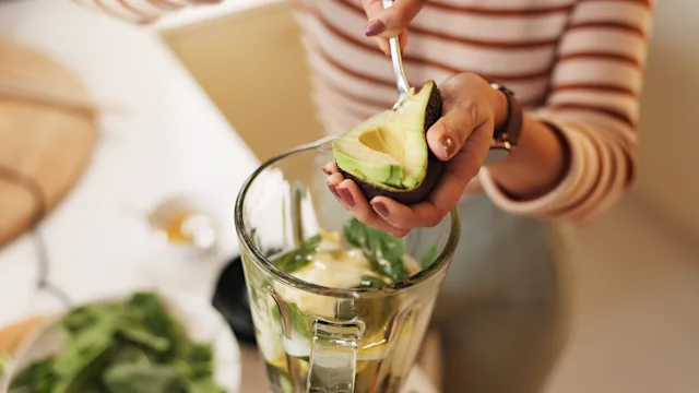 Diet Nutrition: closeup scooping avocado 2222050044