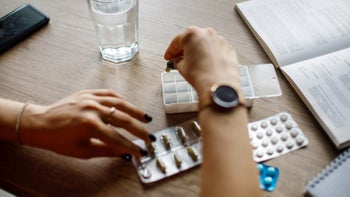 Health: Revlimid: closeup woman organizing medication 1410198073