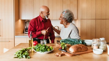 Health: Kidney disease: senior couple cooking together 1191395074