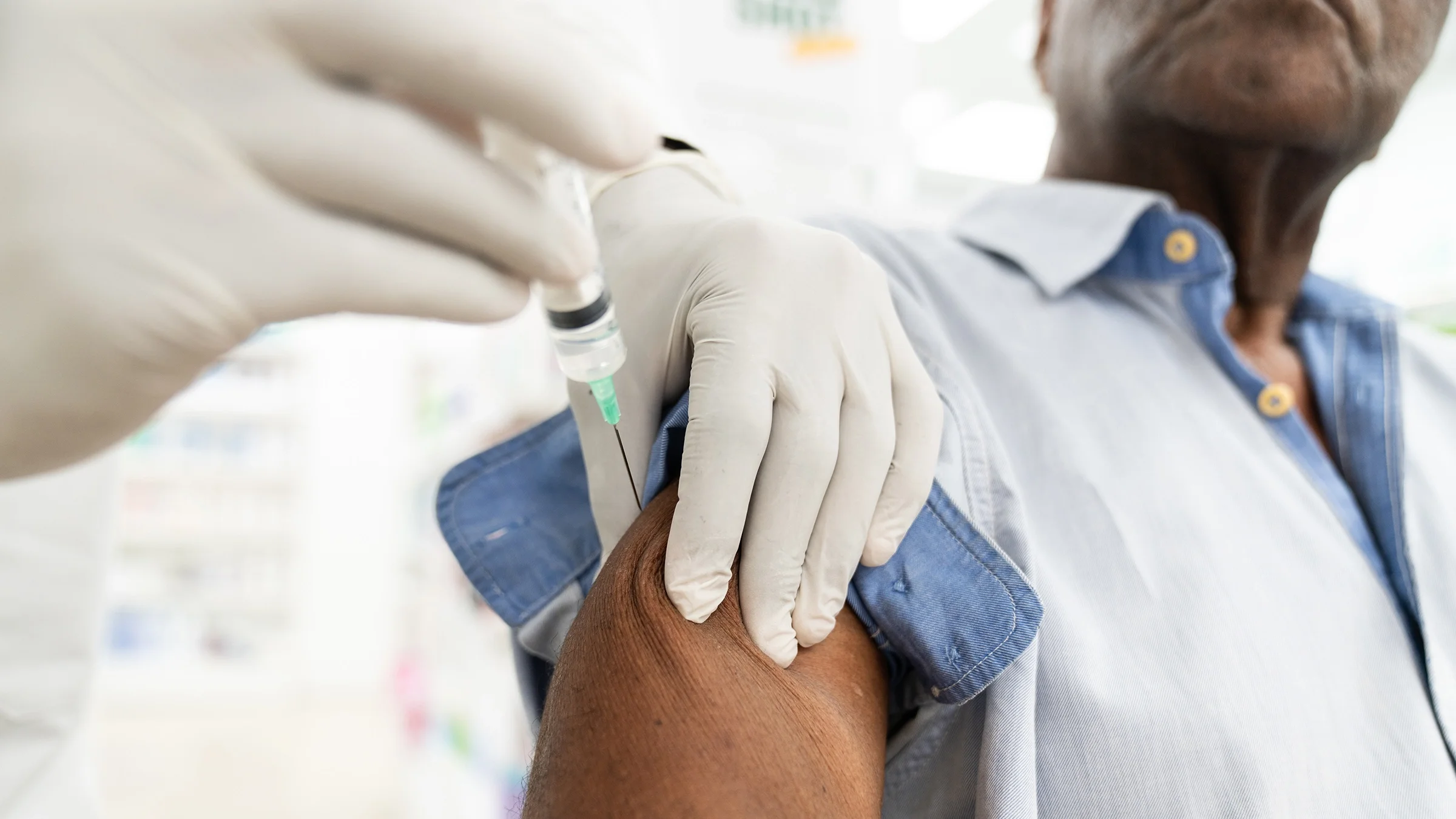 Close-up of a vaccine shot in an arm