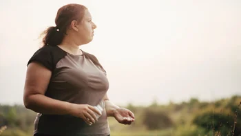 Health: Contrave: woman holding medication bottle 1167244994