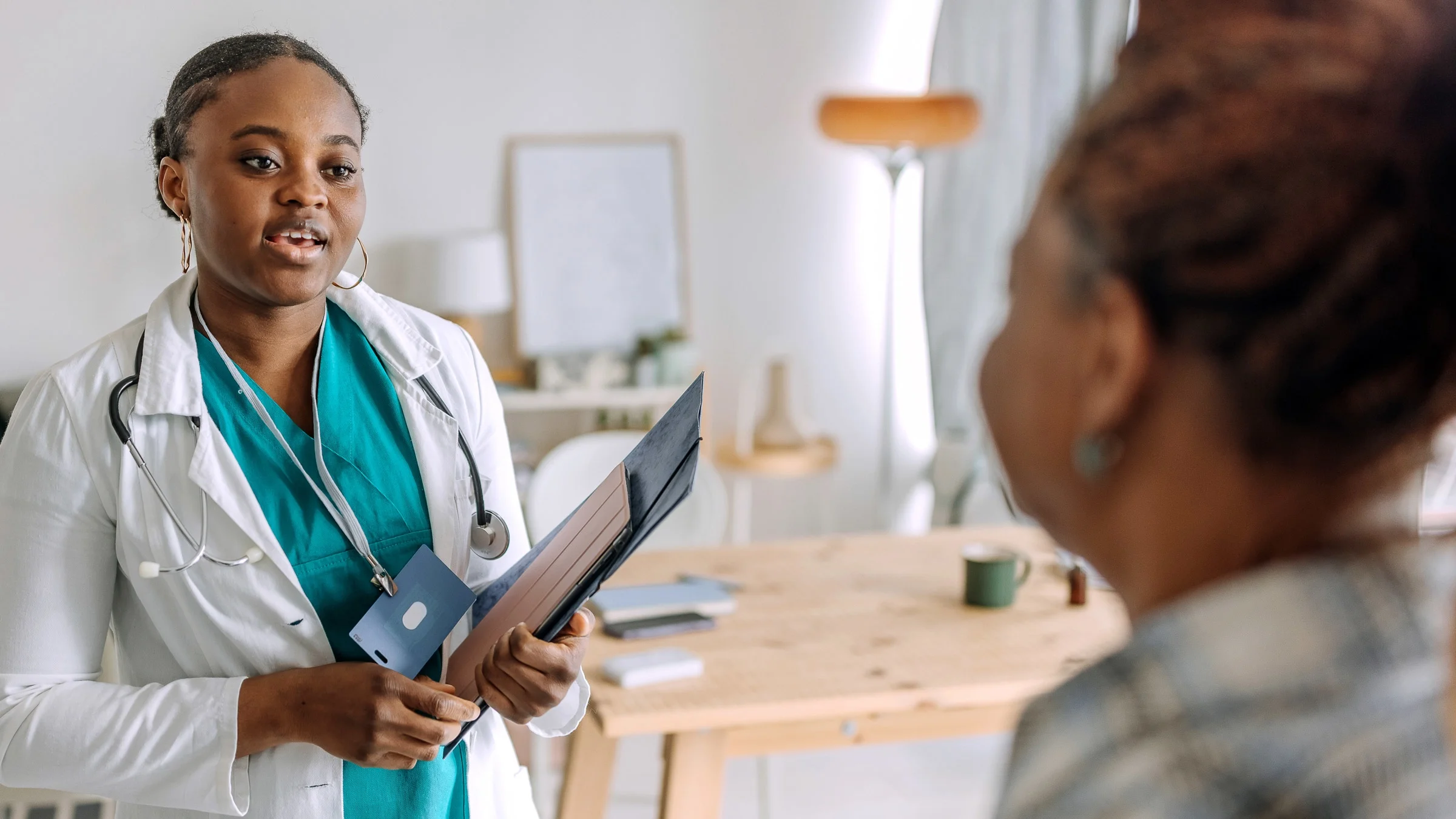 A Black HCP talking to a Black patient.