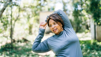 diabetes: woman stretching in a park 1789889117