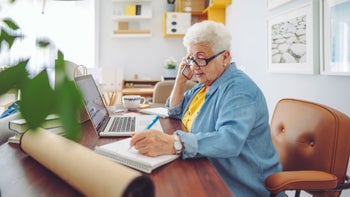 Health: Health insurance: senior woman work from home-1145457577