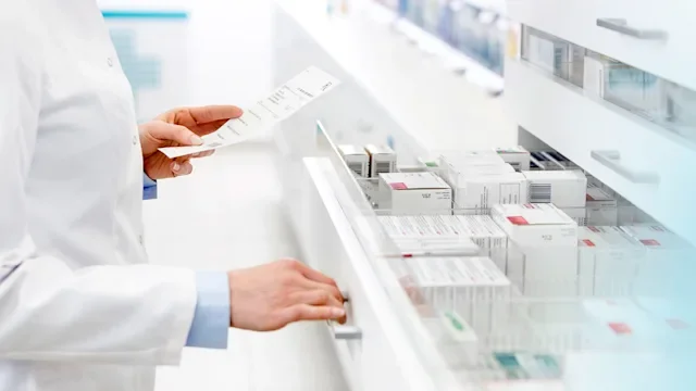 Savings: pharmacist filling a Rx 559537925