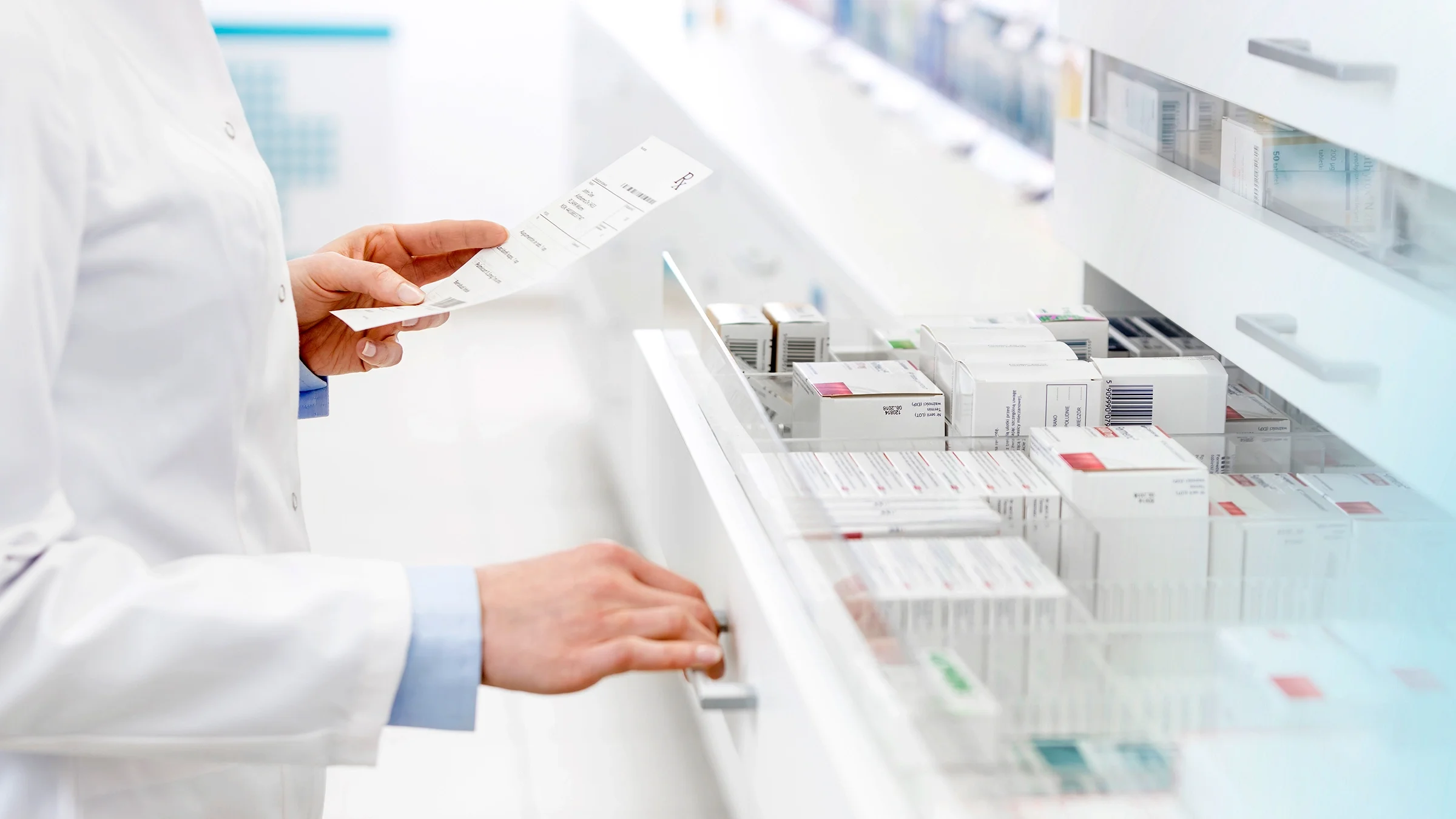 A pharmacist is filling a prescription.