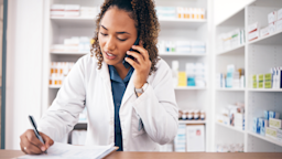 Pharmacist on the phone while taking notes.
Jacob Wackerhausen/iStock via Getty Images Plus