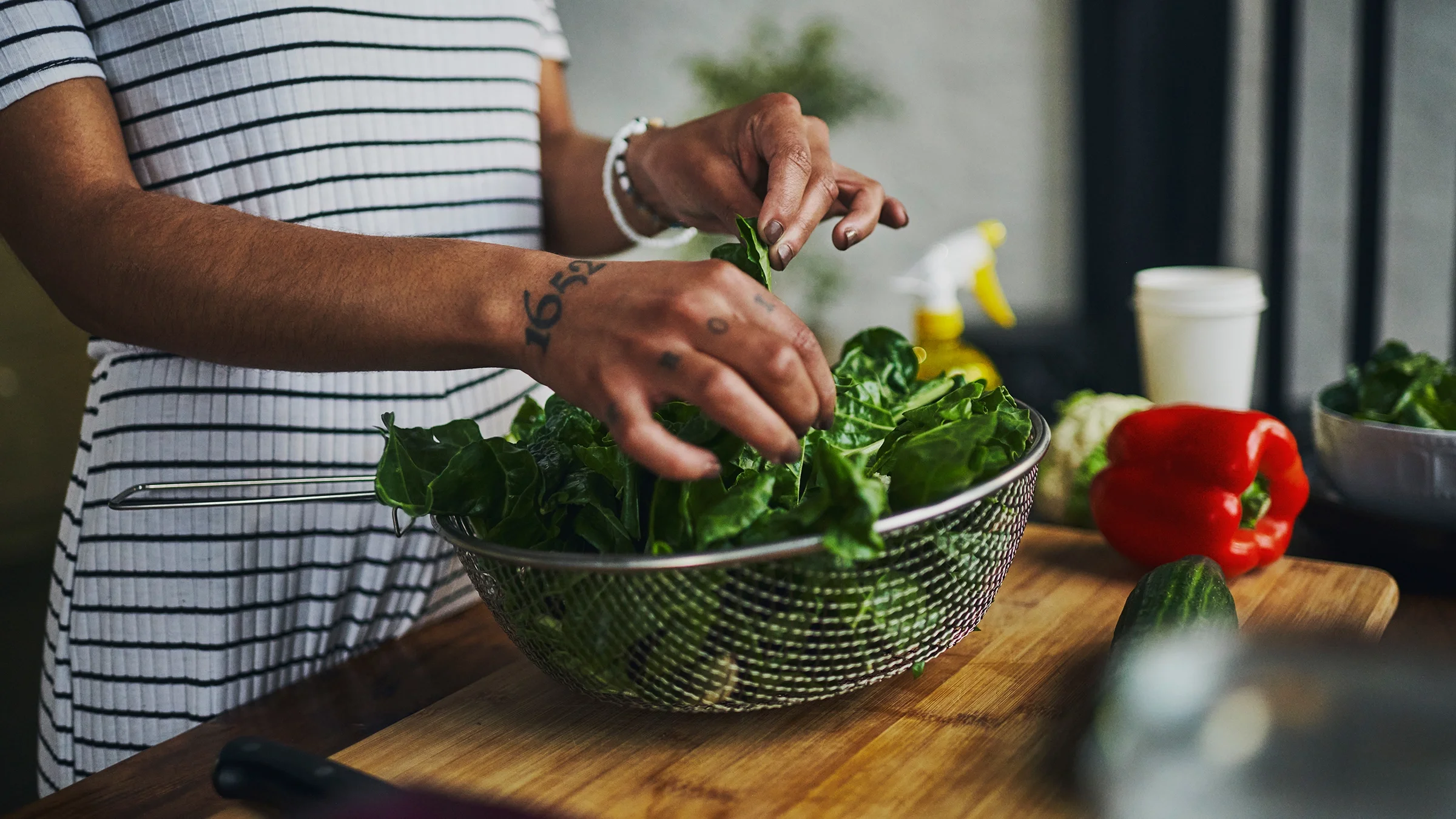 Close-up preparing leafy vegetables.