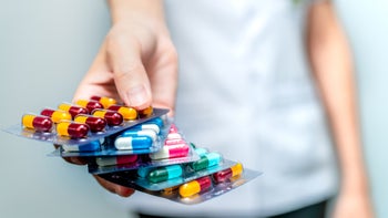 medication education: pills: provider: medication packs in hand-1160737672