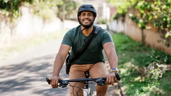 weight-loss: man smiling while riding bicycle 1702828161
