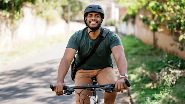 weight-loss: man smiling while riding bicycle 1702828161