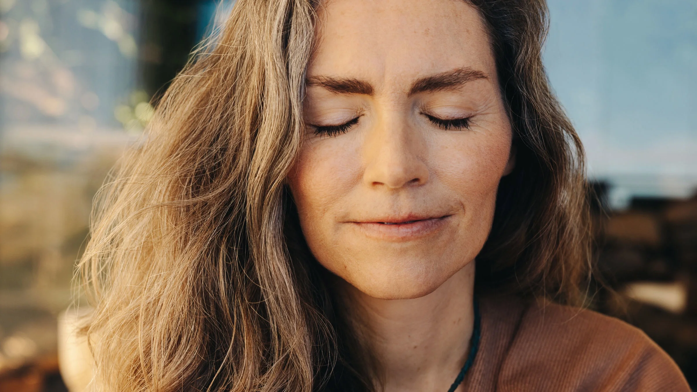 Woman meditating with her eyes closed.