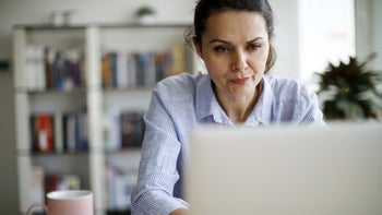 Insurance: woman working on a laptop 1214306022