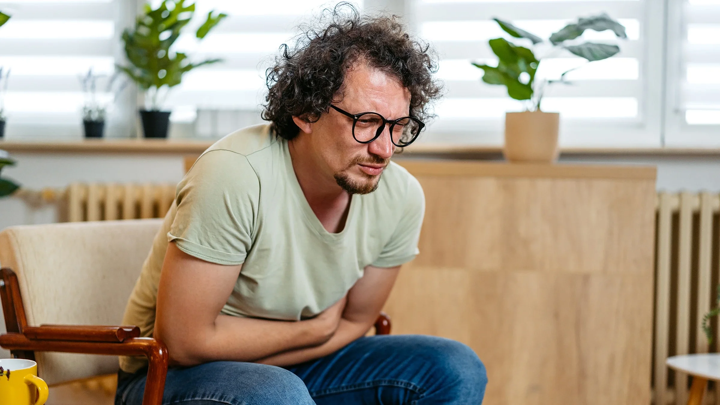 A man experiences a stomachache.