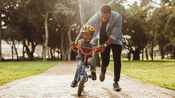 adhd: boy learning how to ride a bike 1126785367