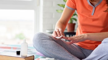 Health: Dermatology: closeup woman using nail polish remover 1230722602