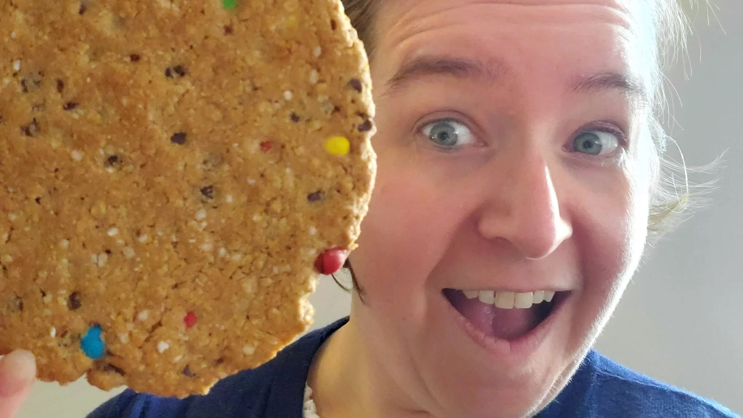 Margaret Clegg, who has celiac disease, next to a cookie. 