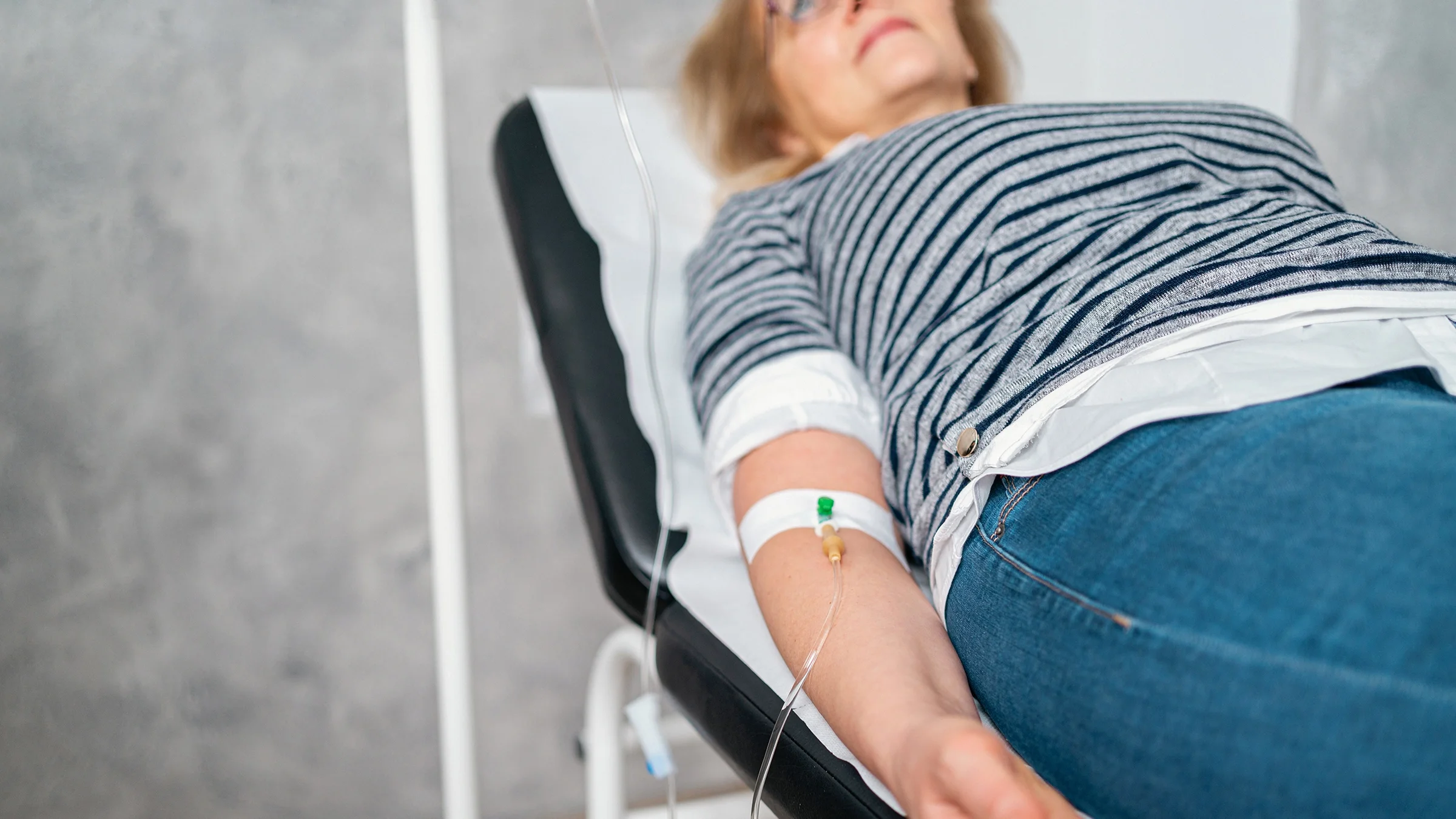 A patient receives an IV drip.