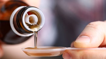 Alternative treatments: Castor oil: close up spoon oil 1204177547