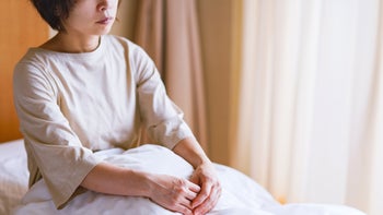 Health: Depression: woman no expression in bed 1299545873