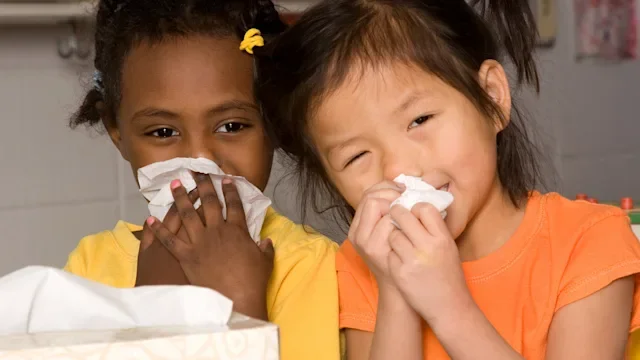 Flu: Contagious: two kids blowing nose 186815294