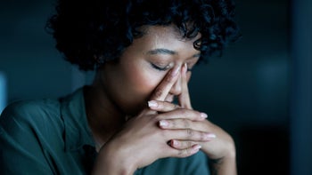 Health: Mental health: woman upset sitting in dark room 1303849519