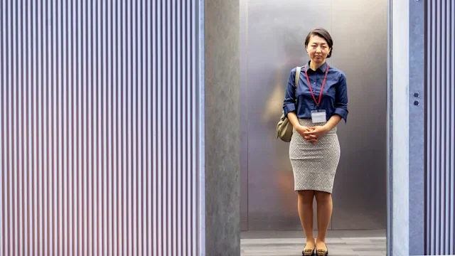 Mental Health: woman elevator 1070917530
