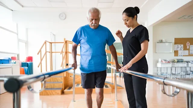 senior man physical therapy bars-1143400998