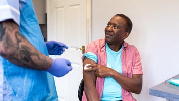 Flu vaccination: man after receiving vaccine 2185728283
