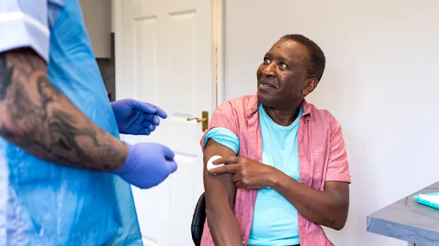 Flu vaccination: man after receiving vaccine 2185728283