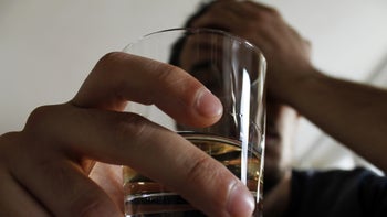 Alcohol: closeup man whisky 911840302