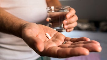 Jardiance: closeup pill in hand 838917776