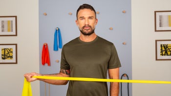 Movement-exercise: man doing external rotation stretch CielitoMVivas GoodRxHealth 2400