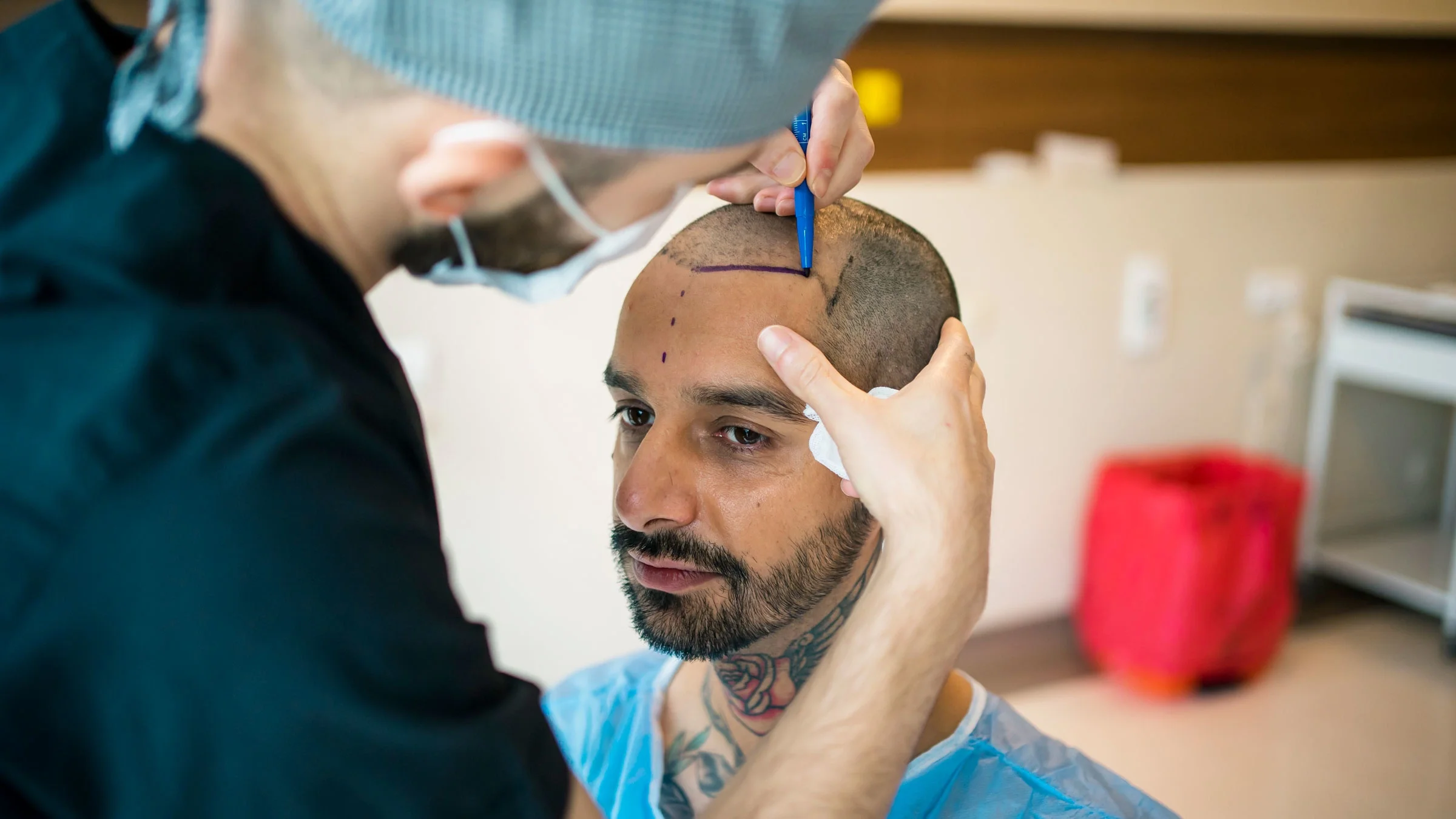 A man preps for a hair transplant.
