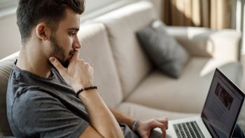 Research: Medical misinformation: reading article on laptop-1086607096