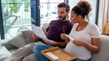 Health: Covid-19: couple reading covid19 test instructions 1345502830