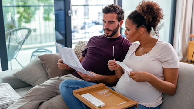 Health: Covid-19: couple reading covid19 test instructions 1345502830