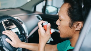 Symbicort: man using inhaler in his car 1805942903