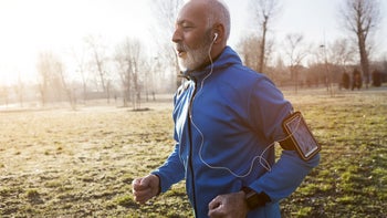 Movement exercise: senior man jogging outside 913661306