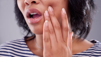 canker-sore: closeup woman with mouth pain 1197153017