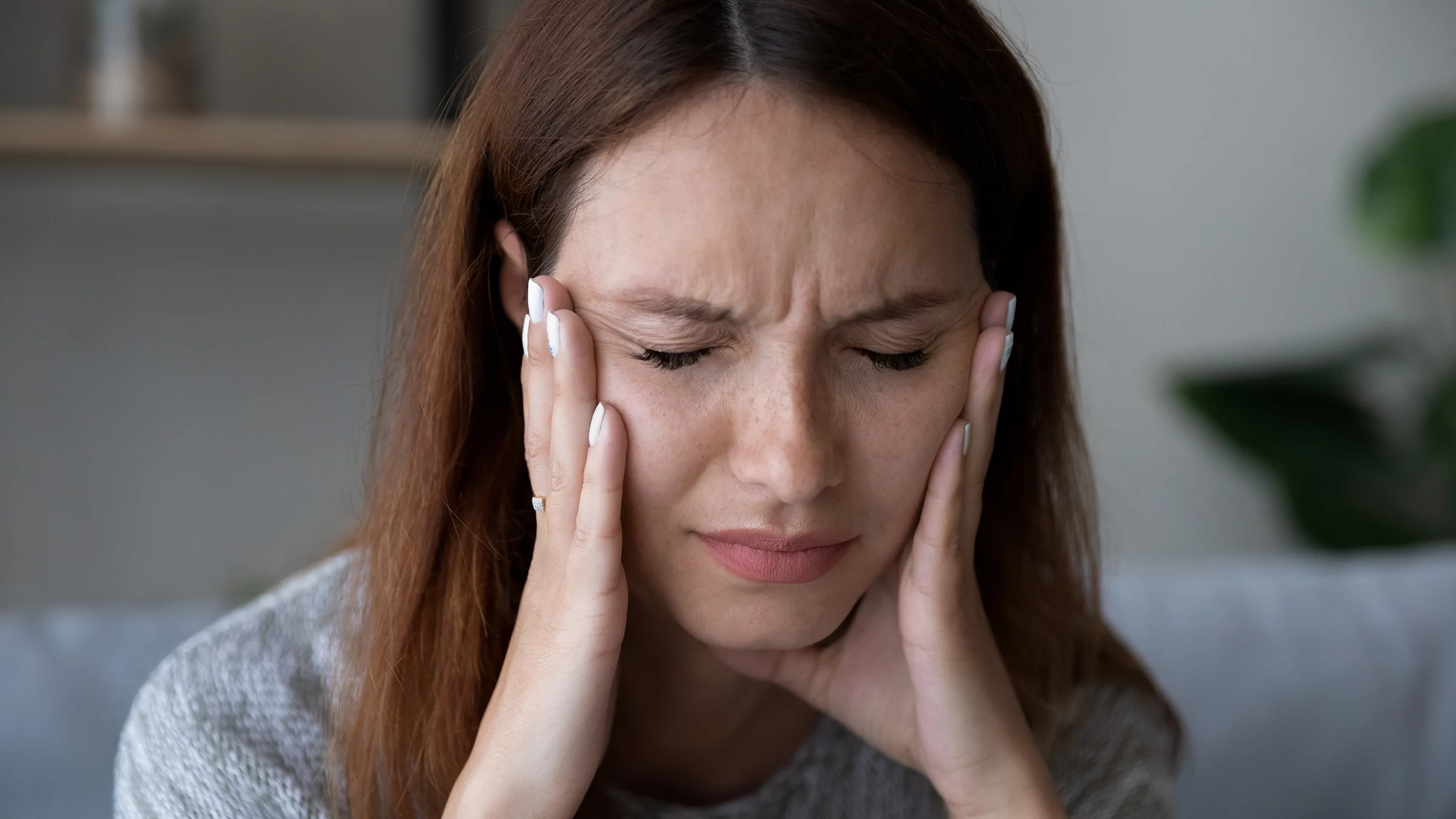 Woman sitting with eyes closed