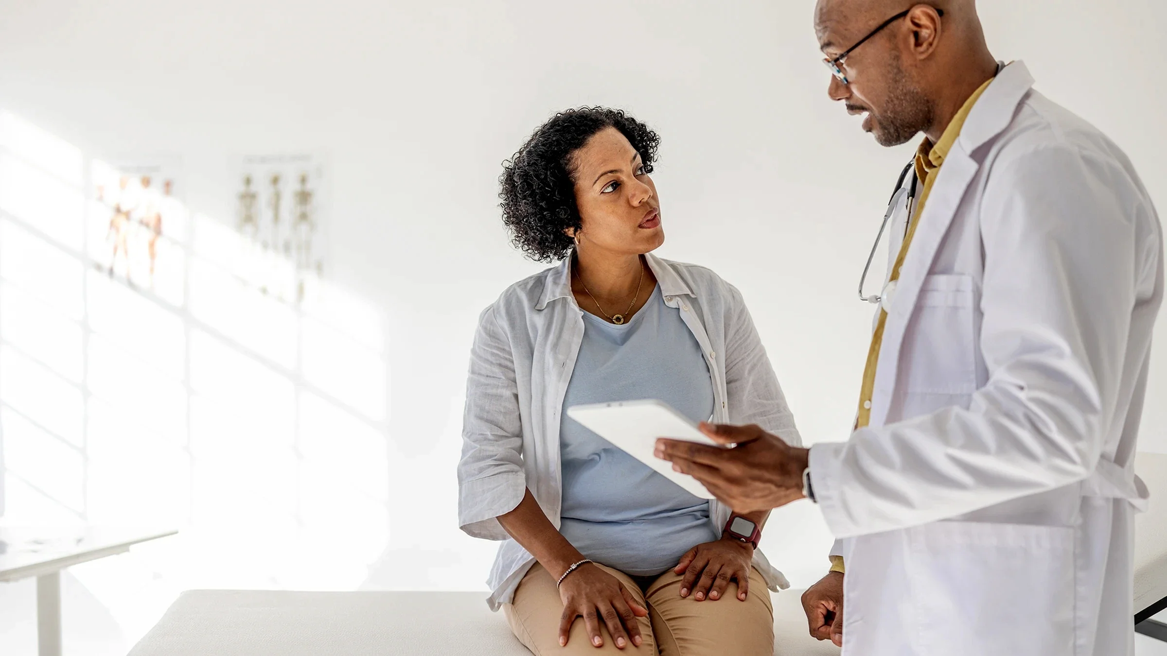 A person speaks to a healthcare professional.