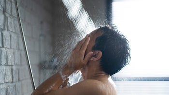 Health: Skincare: man in shower washing face 1303774341
