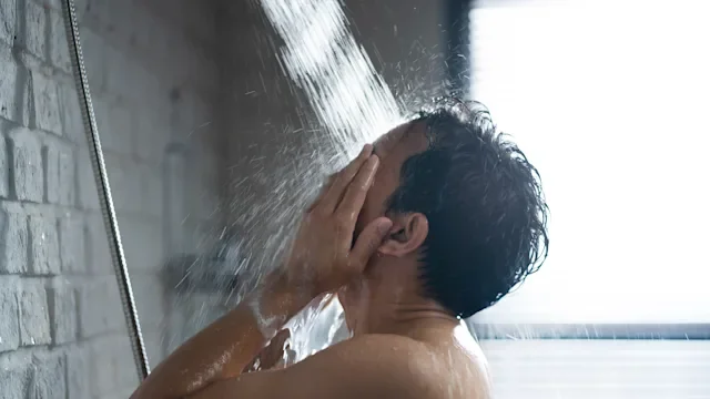 Health: Skincare: man in shower washing face 1303774341