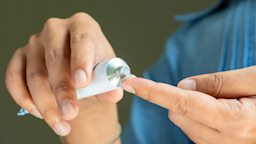 A person squeezes out topical ointment on their finger.
Ake Ngiamsanguan/iStock via Getty Images Plus