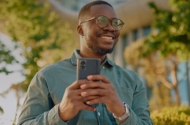 GoodRx Companion member holding a phone