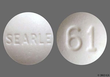 White Round 61 And Searle - Diphenoxylate Hydrochloride/Atropine Sulfate 2.5mg-0.025mg Tablet
