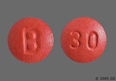 Red-Brown Round B And 30 - Nifedipine 30mg Extended-Release Tablet