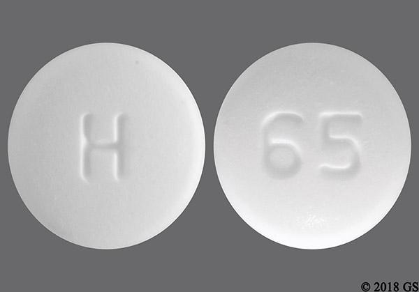 round white pill with the number 210 on it