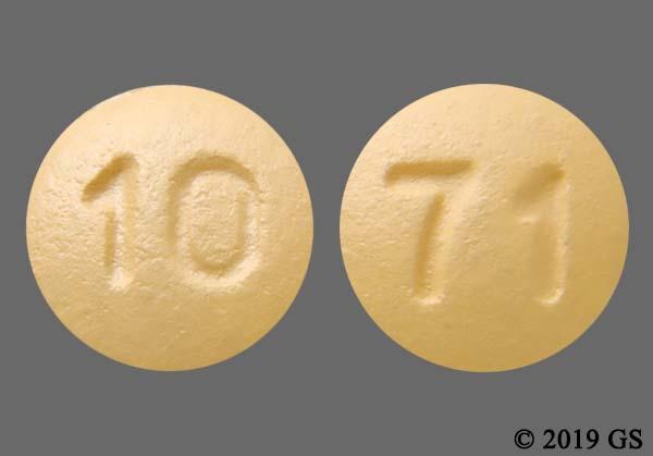 Orange Round 10 And 71 - Vardenafil Hydrochloride 20mg Tablet.